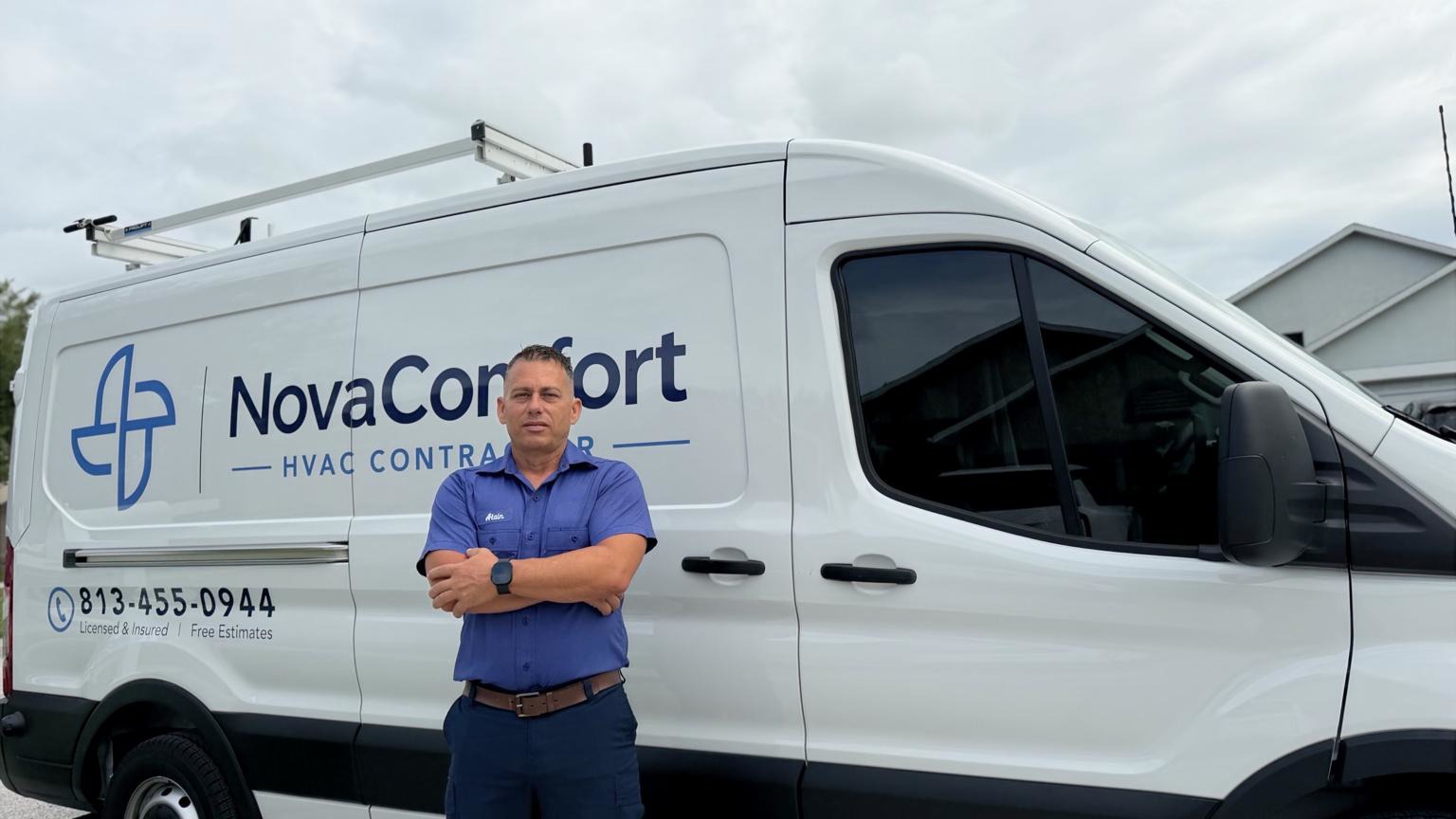 Alain Inza, owner of NovaComfort, standing in front of the NovaComfort service van